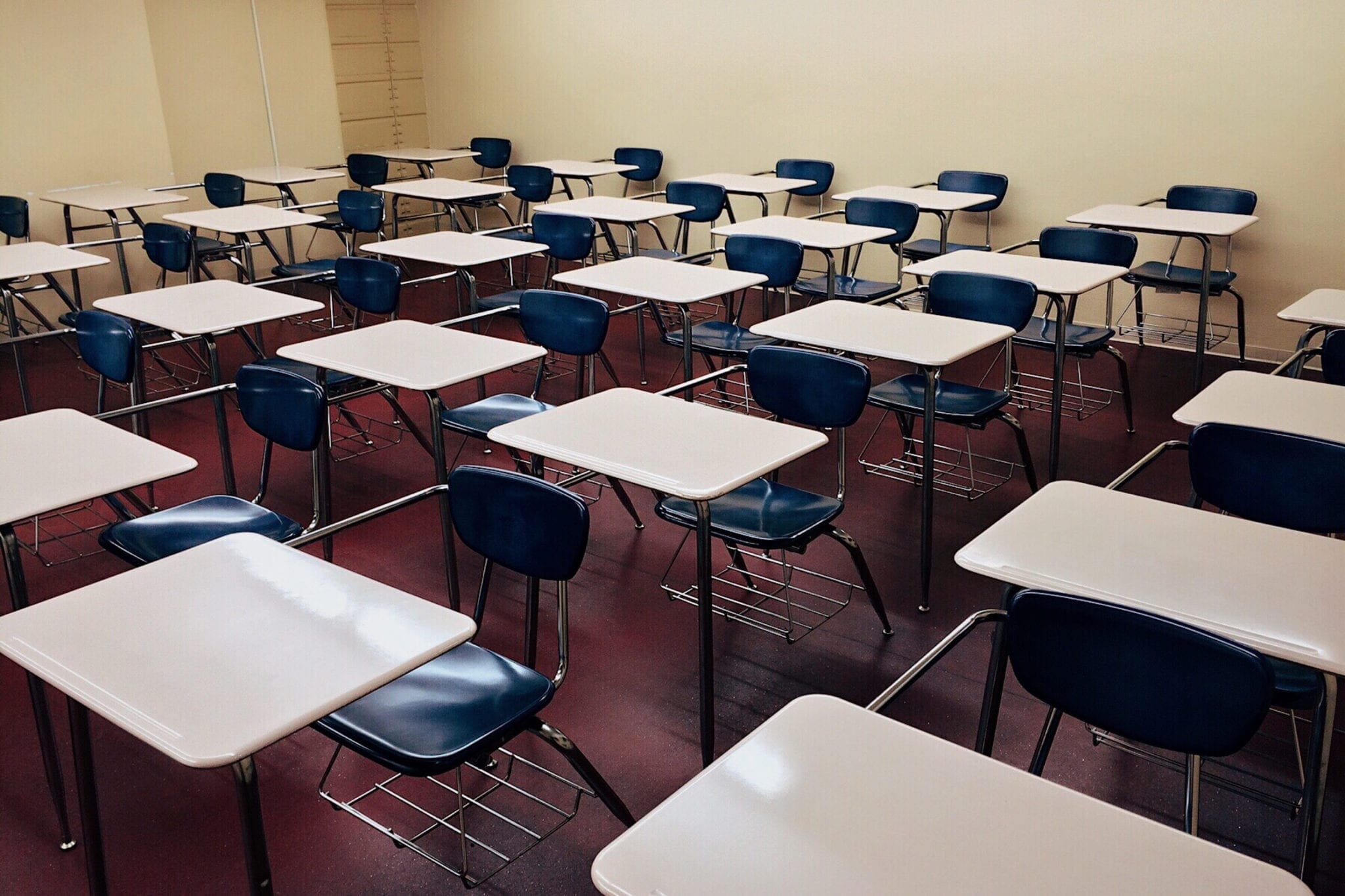 A school classroom full of empty desks